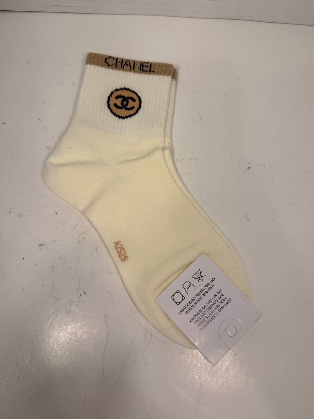 Chanel CC Logo Crew Socks
White and Beige Size M/M